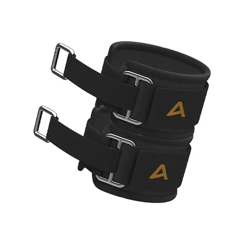 Black AEKE ankle straps with gold 'A' logo and silver metal buckles for cable machines.